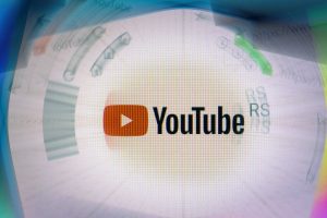 YouTube logo on company website displayed on computer screen with ripple effect
